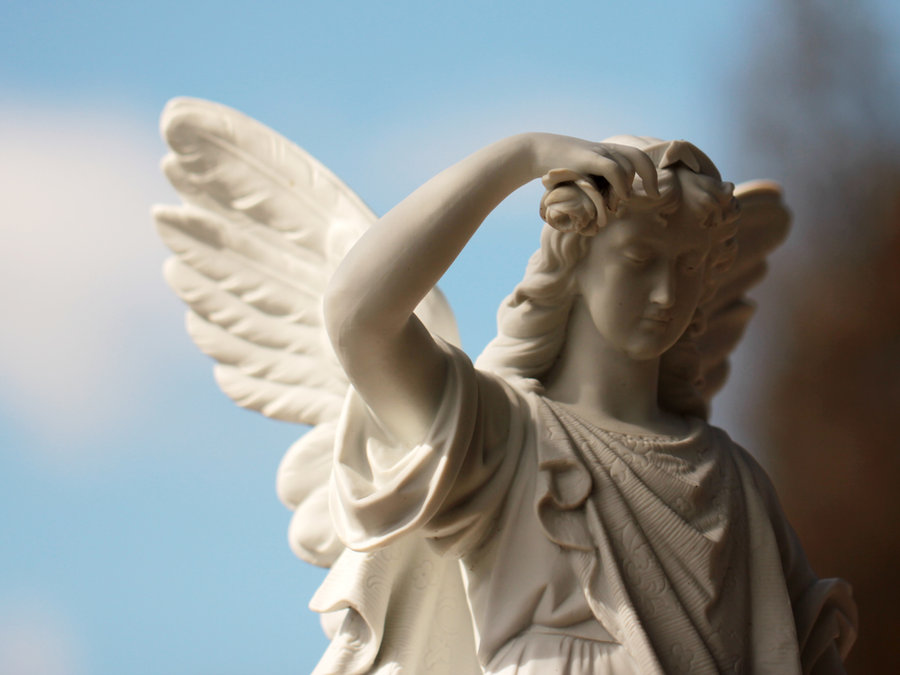 A stone angel resting its head on one hand